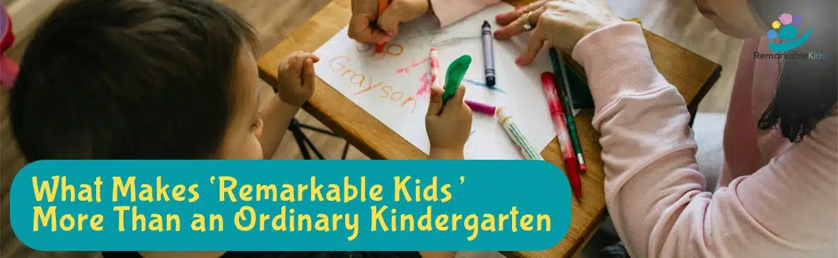 In Content Image OnSiteBlog Jan 2025 Remarkable Kids Children sit at a table drawing and writing with crayons at Remarkable Kids in Auckland, New Zealand, with the heading “What Makes Remarkable Kids More Than an Ordinary Kindergarten”.